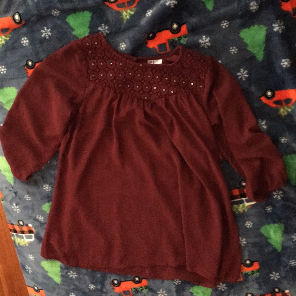A burgundy blouse